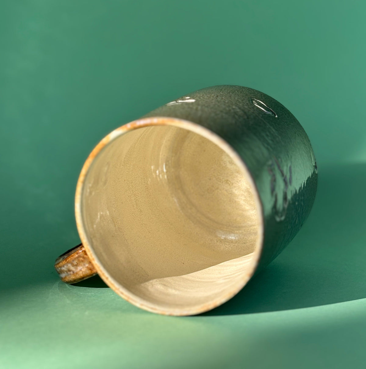 Salt fired mug with sprayed ash glaze