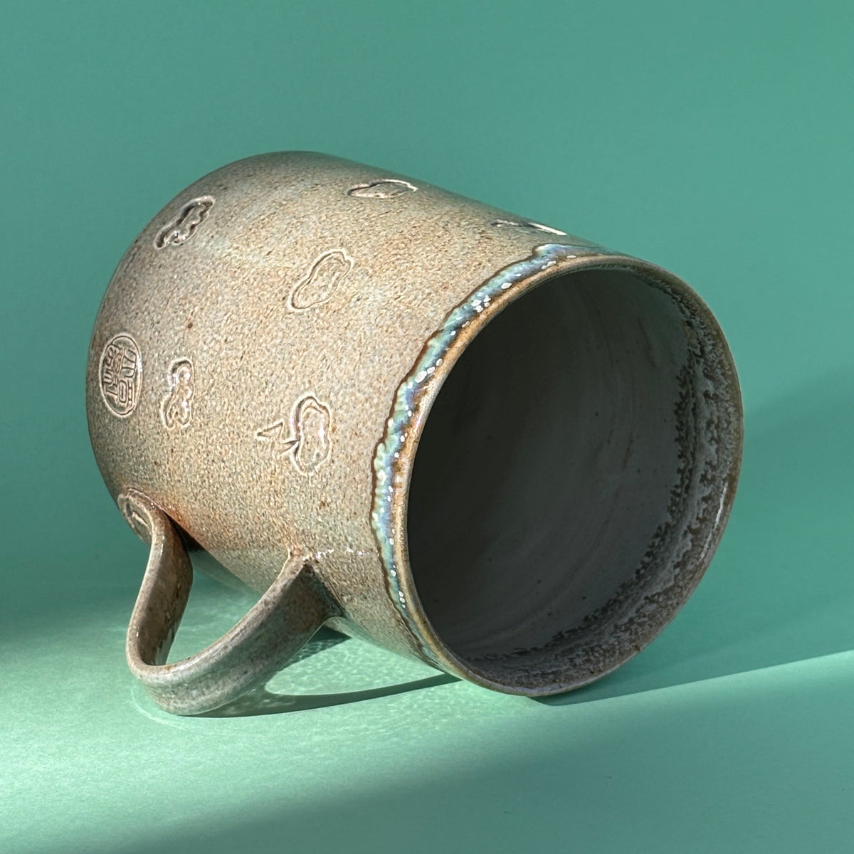 Salt fired mug with galactic glaze