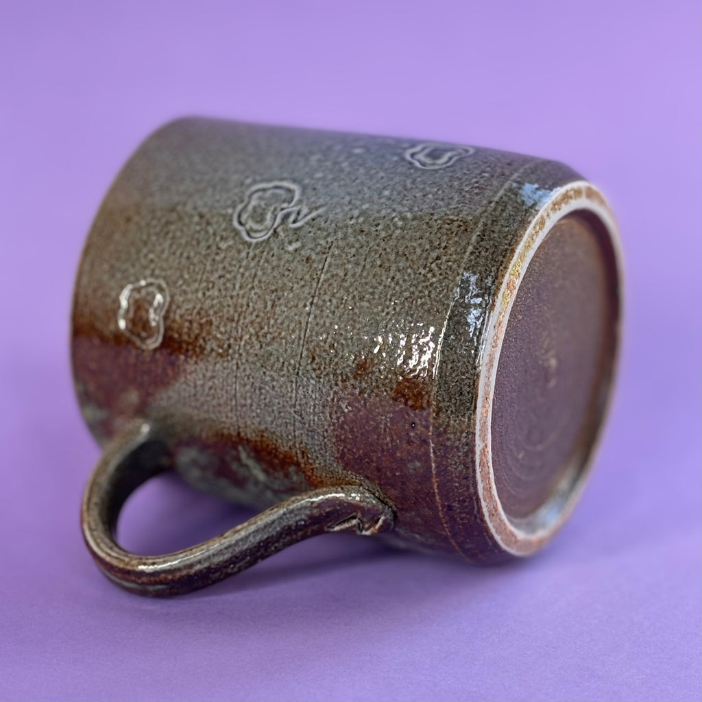 Salt fired mug with sprayed ash glaze