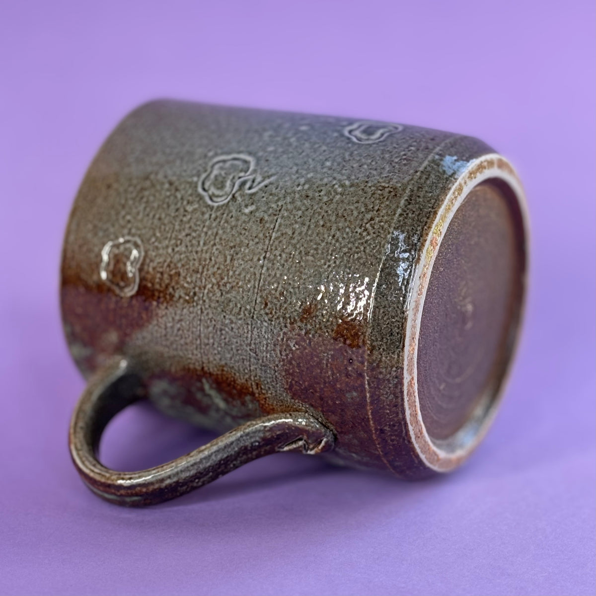 Salt fired mug with sprayed ash glaze