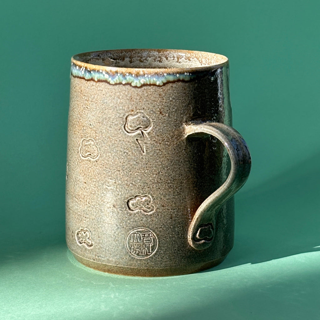 Salt fired mug with galactic glaze