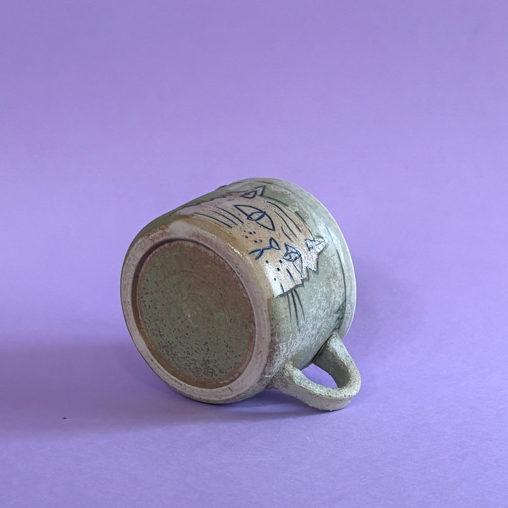 Pensive cat mug