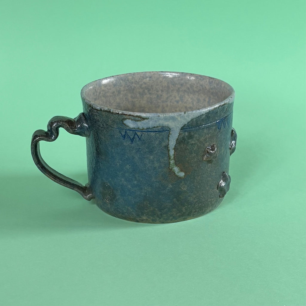 Impish cat mug