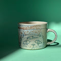 Downcast cat mug