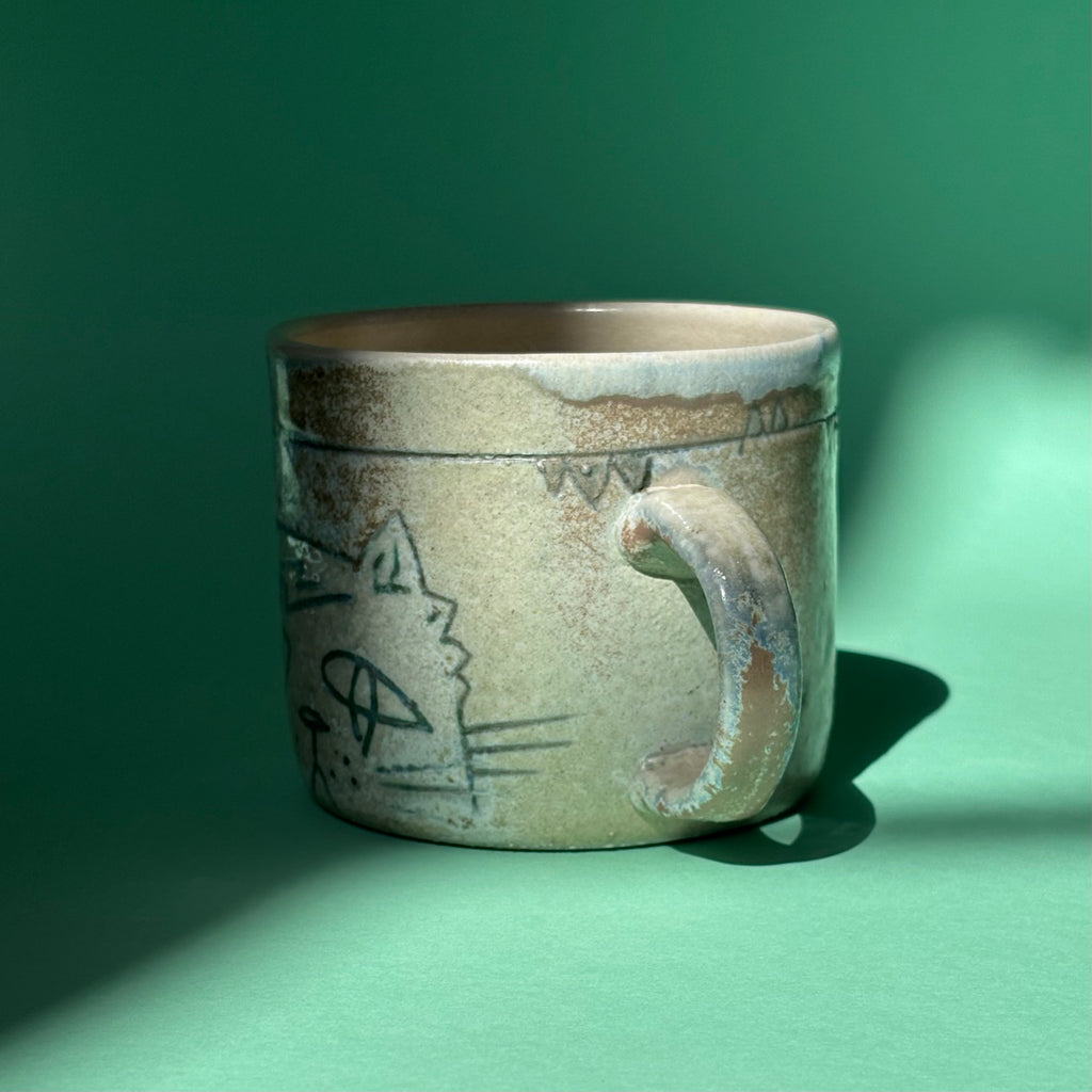 Downcast cat mug