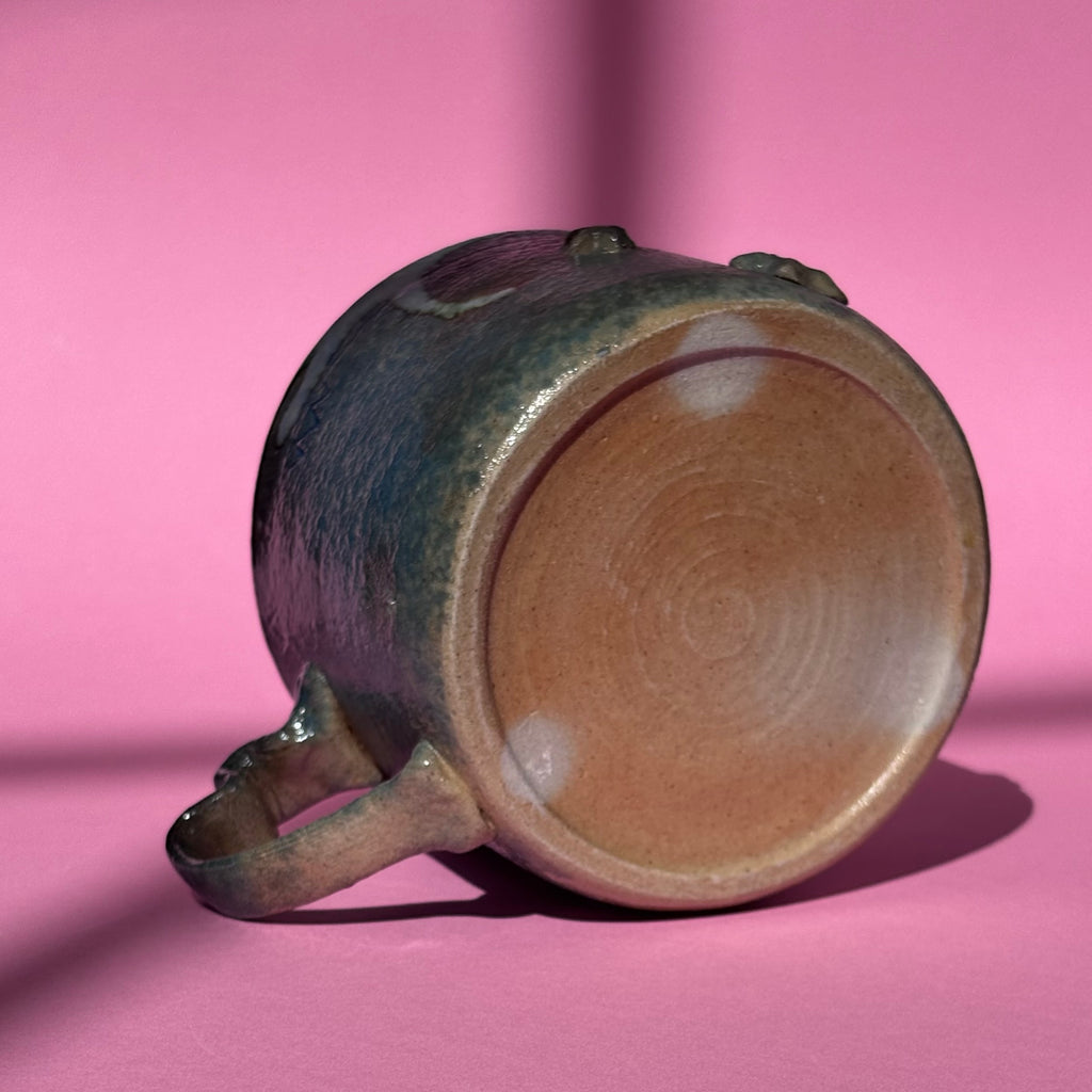 Impish cat mug