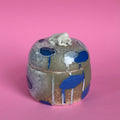 Lidded jar with butted frog