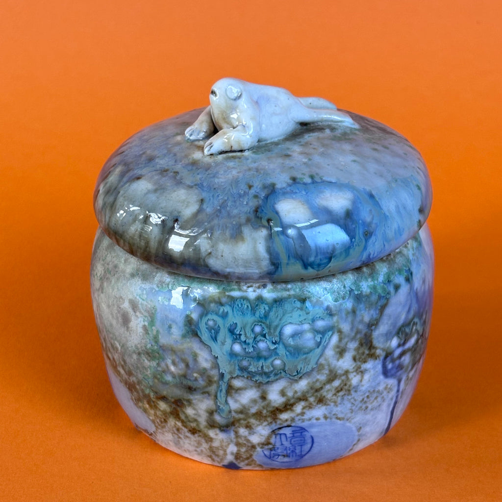 Lidded jar with butted frog