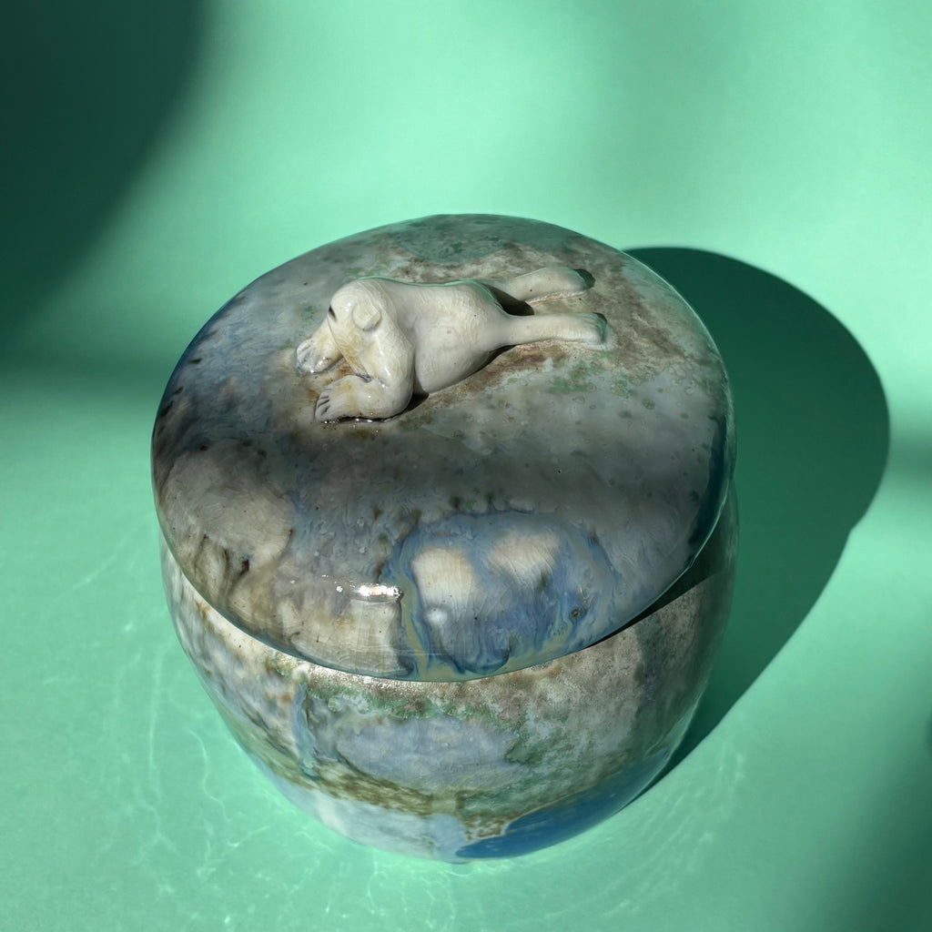 Lidded jar with butted frog