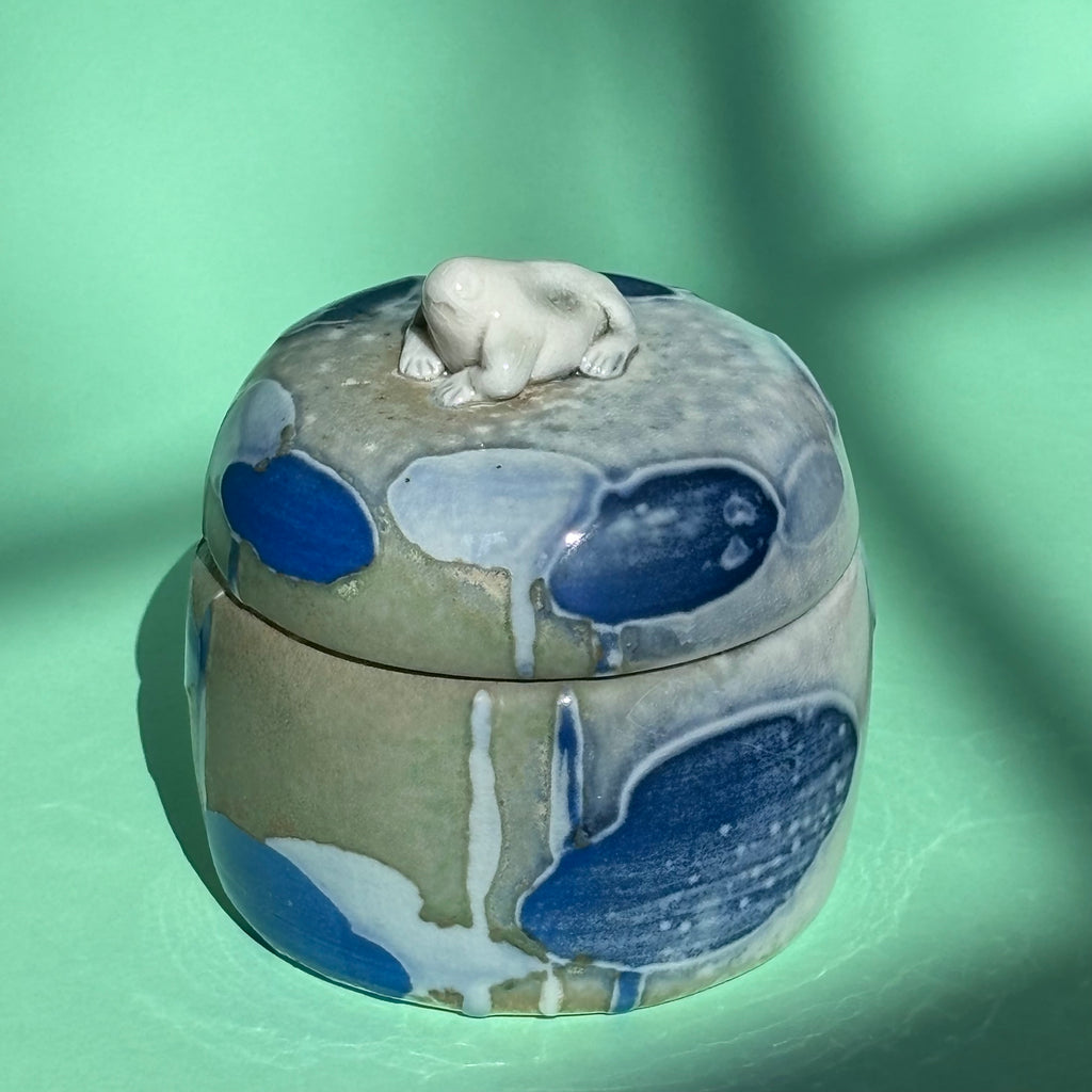 Lidded jar with butted frog