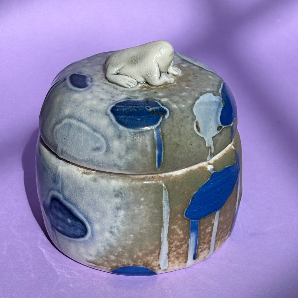 Lidded jar with butted frog
