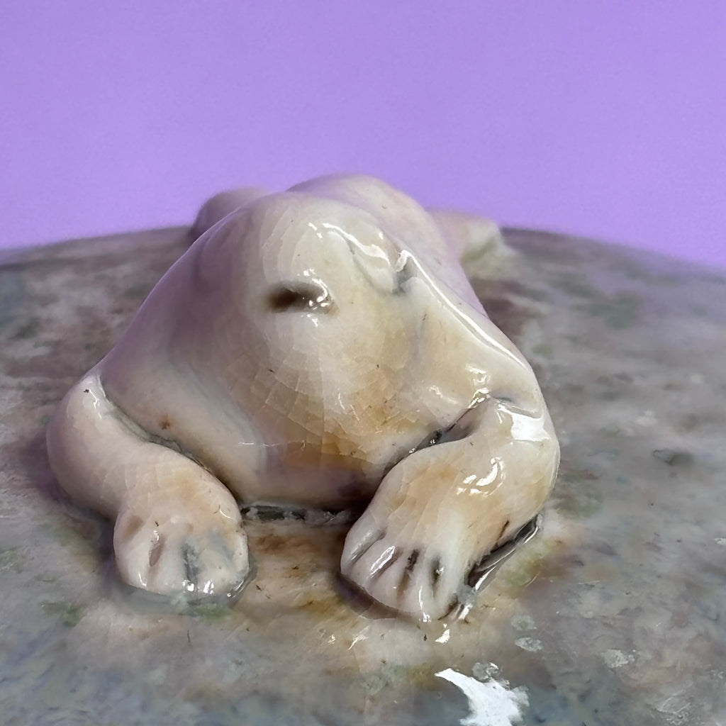 Lidded jar with butted frog