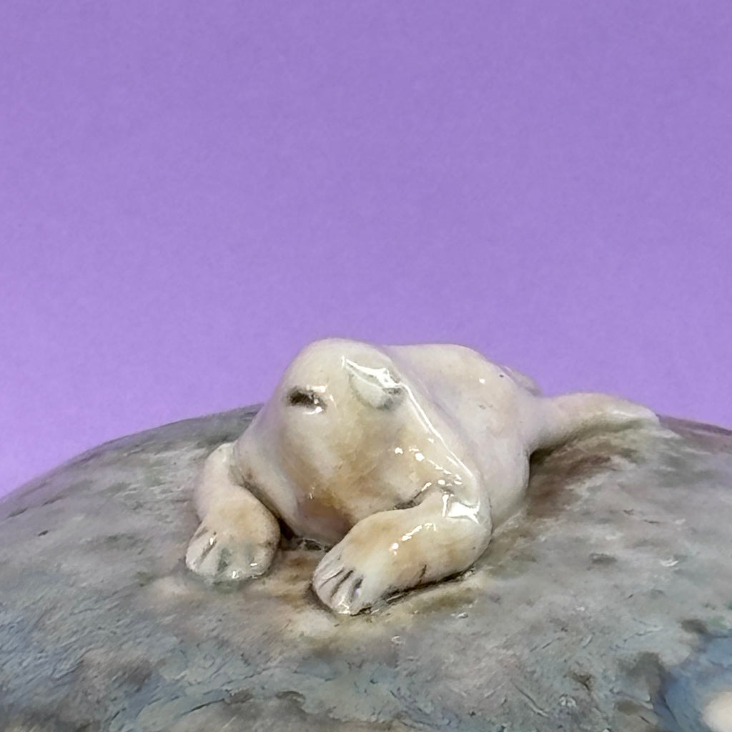 Lidded jar with butted frog