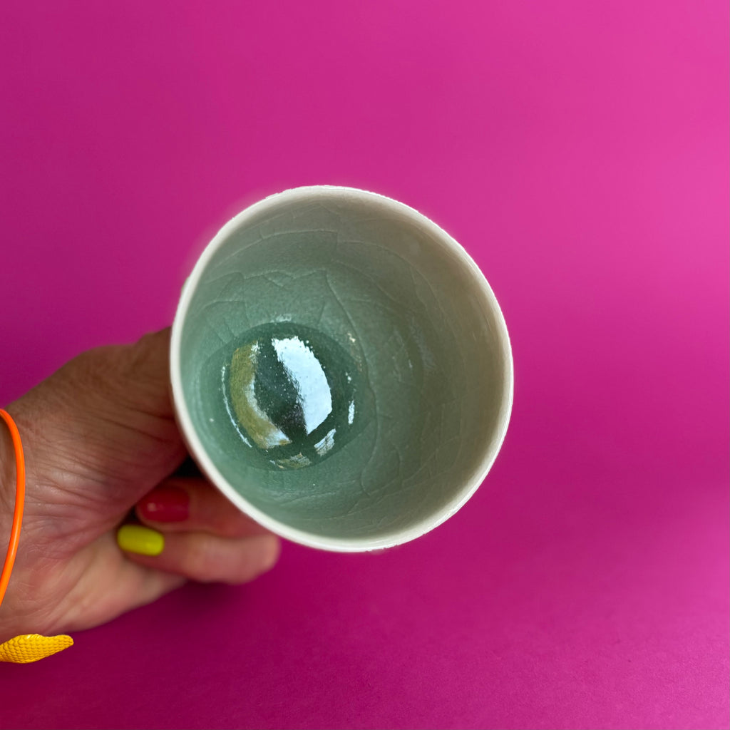 Salt fired cup with slip decoration