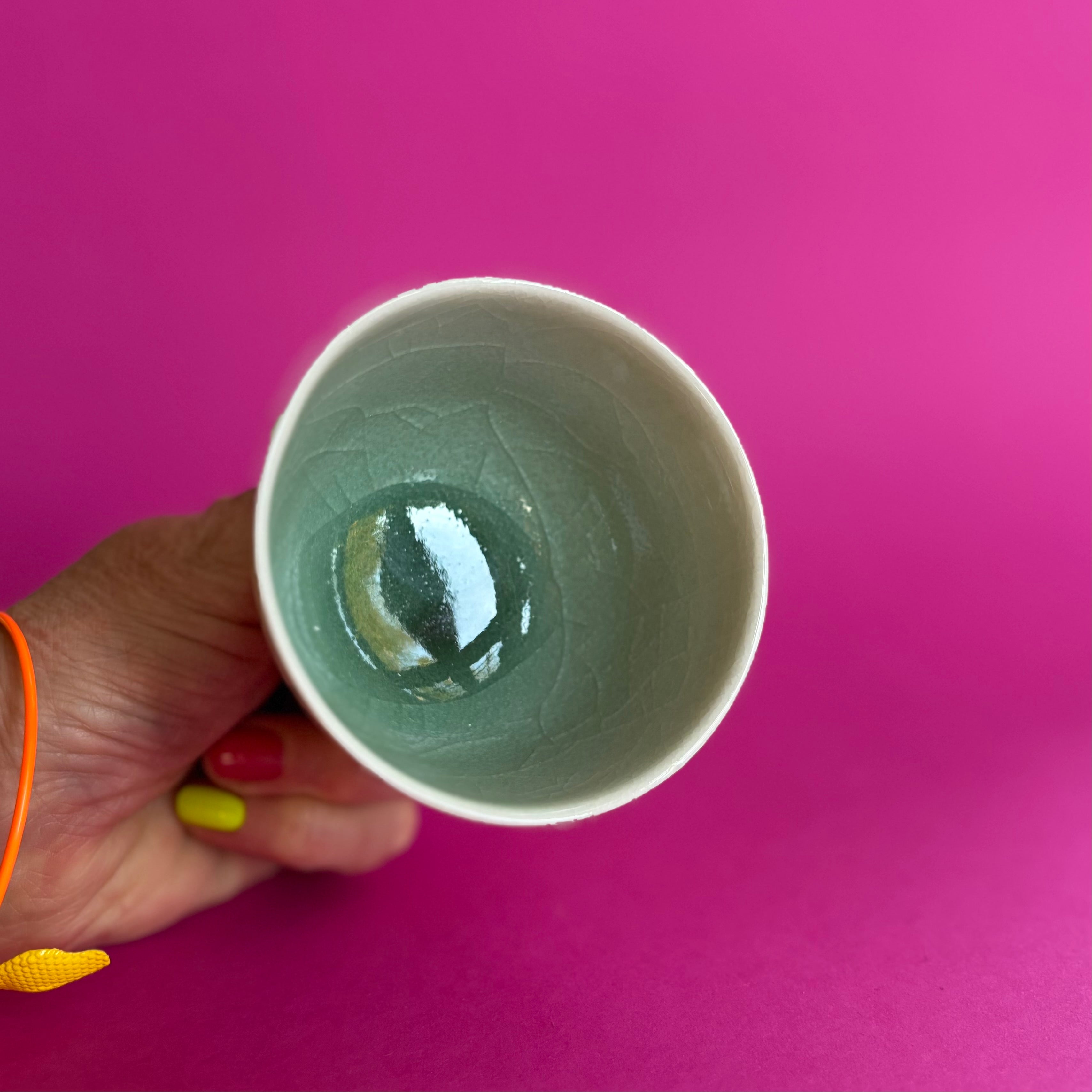 Salt fired cup with slip decoration