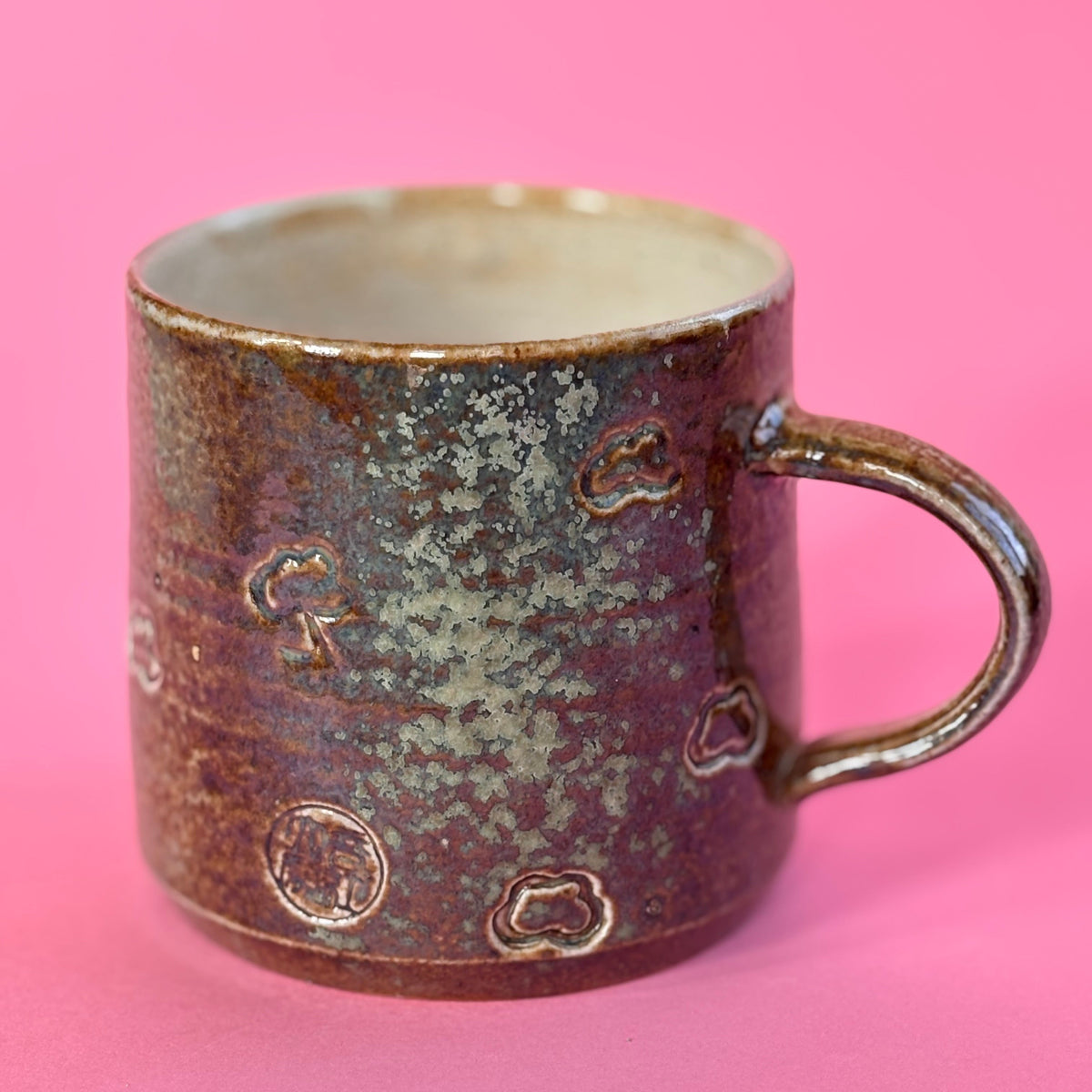 Salt fired mug with sprayed ash glaze