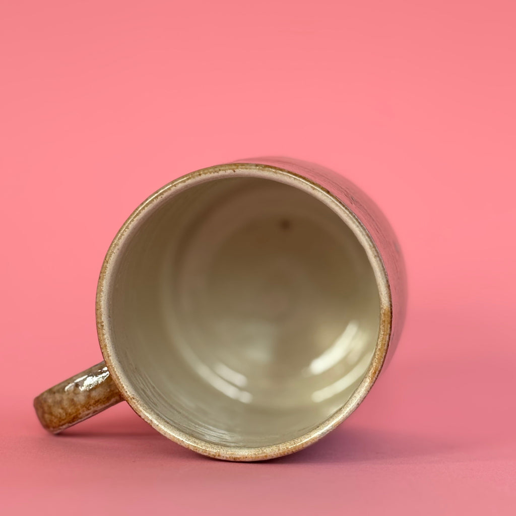Salt fired mug with sprayed titanium glaze