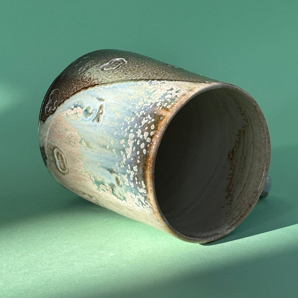 Salt fired mug with galactic glaze