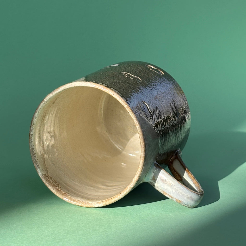 Salt fired mug with galactic glaze