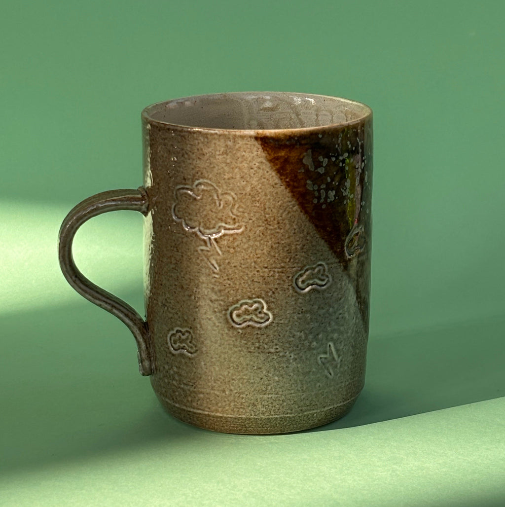 Salt fired mug with galactic glaze