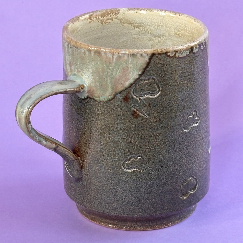 Salt fired mug with galactic glaze