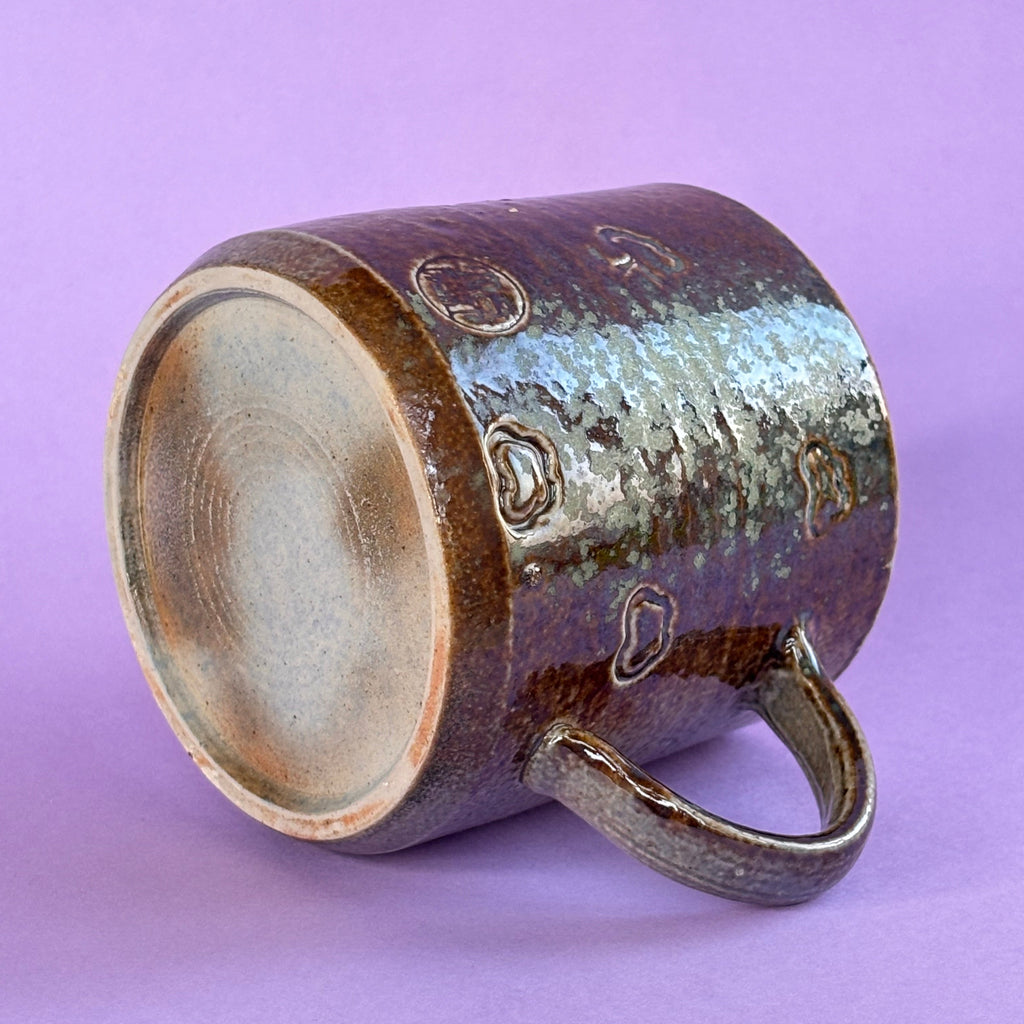 Salt fired mug with sprayed ash glaze